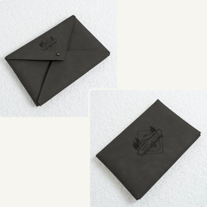 Vegan leather envelope in anthracite – front with closure and back, both engraved