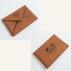 Vegan leather envelope in brown – front with closure and back, both engraved