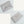 Vegan leather envelope in white – front with closure and back, both engraved